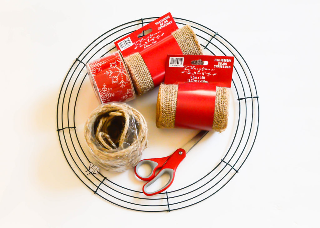 This Christmas burlap wreath is the perfect way to add some rustic charm to your home for the holiday season! It screams Farmhouse and is super budget-friendly! Pop over to get all of the details on how to make one yourself!